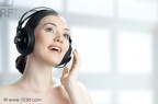 7325998-girl-with-headphones-on-the-blury-background