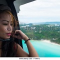 beautiful-asian-girl-in-a-helicopter-over-boracay-philippines-fyn47j