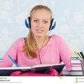 high-school-student-homework-making-desk-music-headphones-46652082.jpg