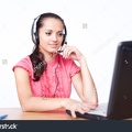 stock-photo-call-center-female-operator-young-happy-smiling-woman-sitting-at-office-desk-with-headset-isolated-85007884.jpg