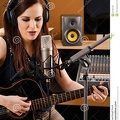 woman-recording-studio-photo-beautiful-brunette-playing-acoustic-guitar-singing-large-diaphragm-microphone-37769749.jpg