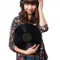 woman-with-headphones-holding-a-vinyl-record 1187-1516
