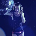 Vintage headphones girl dances under disco ball