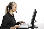 technology-woman-with-headset-at-computer-small 1