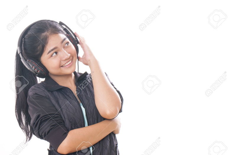 33468299-Young-woman-with-headphones-listening-music--Stock-Photo.jpg