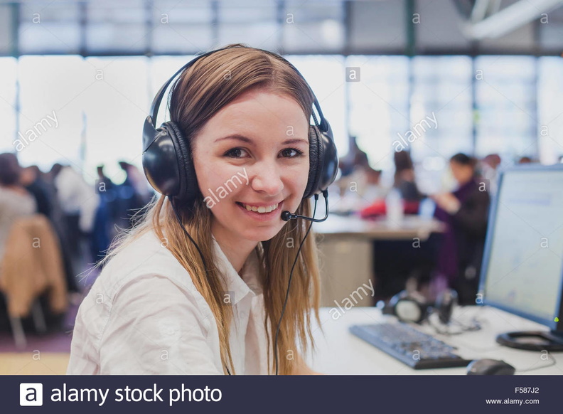 happy-student-with-headphones-and-computer-in-university-F587J2.jpg