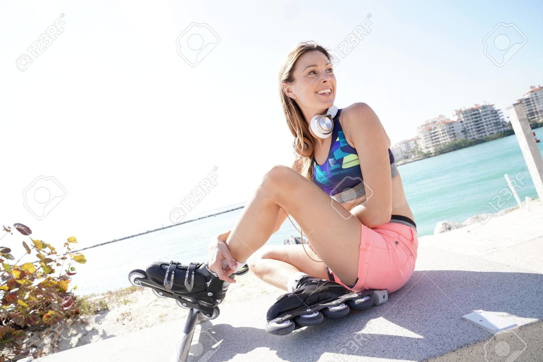 94773851-roller-skater-relaxing-and-listening-to-music-with-headphones.jpg