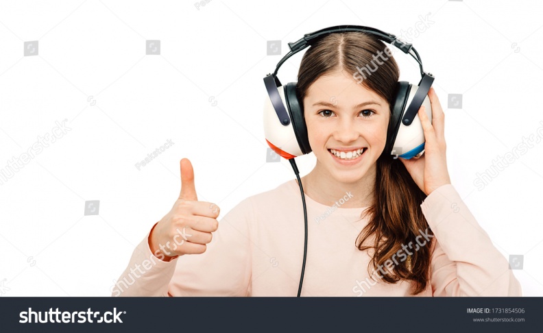 stock-photo-hearing-test-positive-girl-in-headphones-during-a-hearing-test-isolated-on-white-audiometry-1731854506.jpg