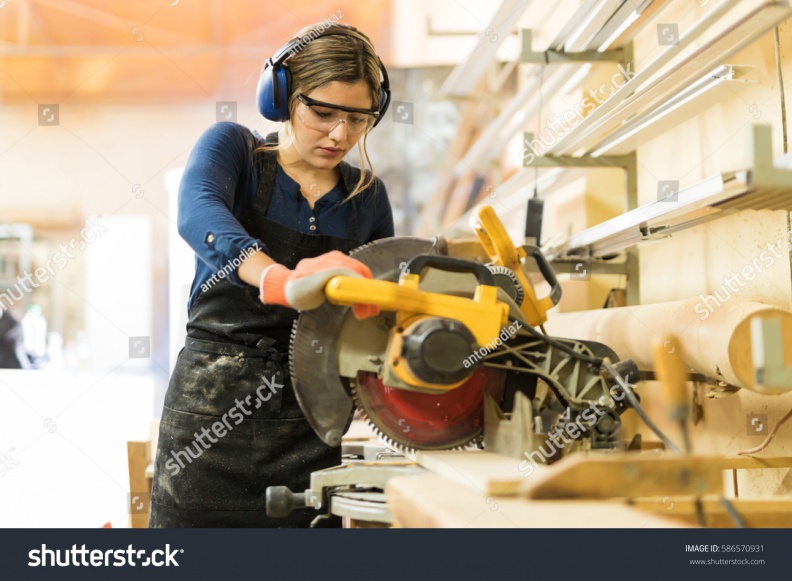 stock-photo-attractive-female-carpenter-using-some-power-tools-for-her-work-in-a-woodshop-586570931.jpg
