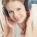 beautiful-girl-enjoys-listening-to-music-24469605