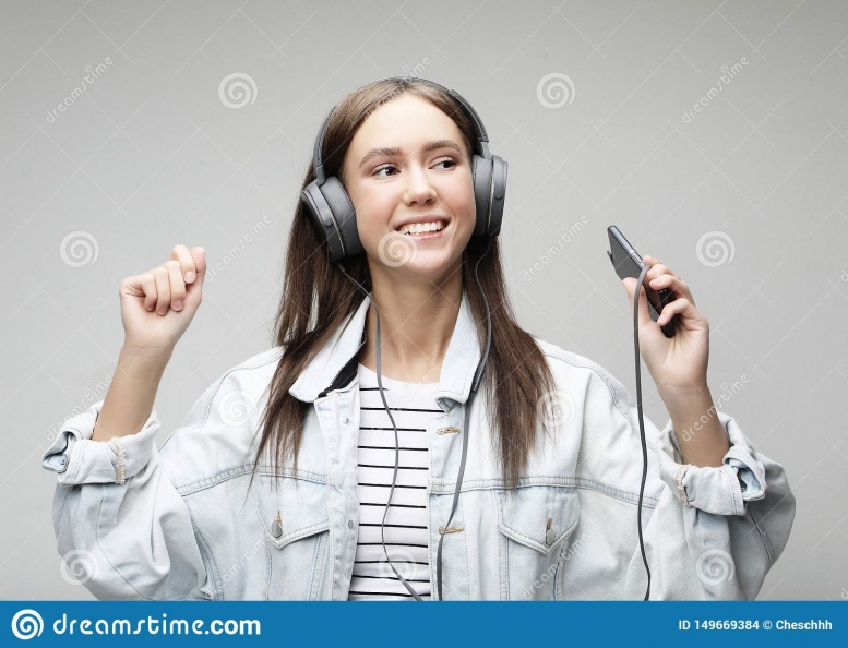 beautiful-young-woman-listening-to-music-headphones-smartphone-lifestyle-people-concept-grey-background-149669384.jpg