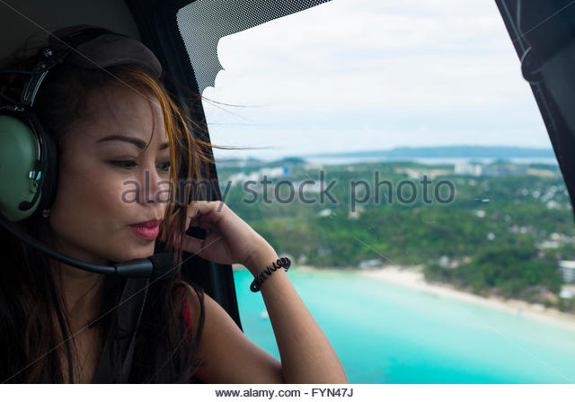 beautiful-asian-girl-in-a-helicopter-over-boracay-philippines-fyn47j.jpg