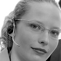 girl in office wearing headset 430x190