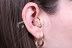 istockphoto 8166404-brunette-woman-with-modern-hearing-aid