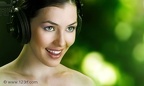 7326003-girl-with-headphones-on-the-blury-background