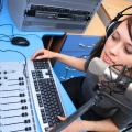 10176925194 794ef67345 o - A radio DJ announces news in a studio