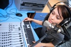 10176925194 794ef67345 o - A radio DJ announces news in a studio