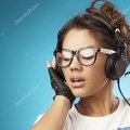 depositphotos 35710407-stock-photo-young-woman-with-headphones-listening