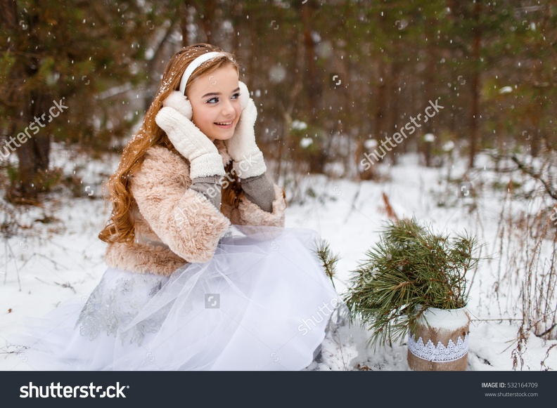 stock-photo-attractive-young-girl-in-wintertime-outdoor-a-girl-in-the-winter-forest-smiling-and-cheering-532164709.jpg