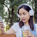 indonesian-girl-listening-music-with-headphones-and-smart-phone 1437-673