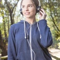joyful-young-woman-with-hooded-sweatshirt-and-headphones 23-2147562196
