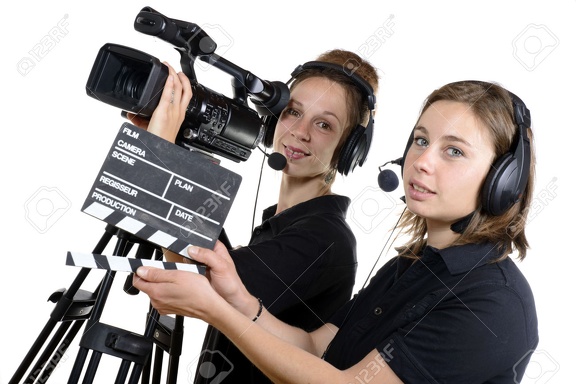 28704786-two-young-women-with-a-video-camera-and-a-clapper-board-Stock-Photo