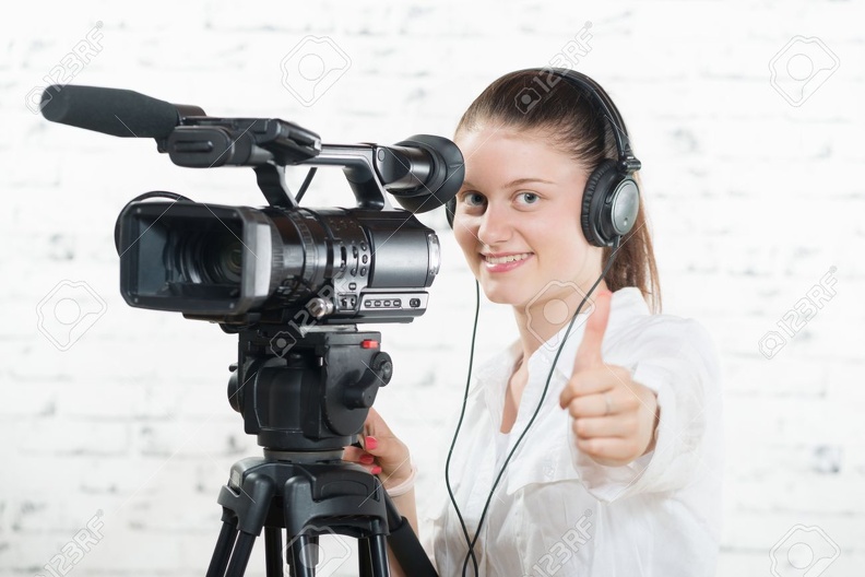 45555120-a-pretty-young-woman-with-a-professional-camera-Stock-Photo.jpg