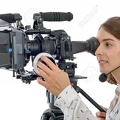 67099147-beautiful-young-woman-with-DSLR-video-camera-and-headphones-Stock-Photo