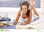 pretty-girl-writing-homework-laying-floor-17097806