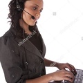 stock-photo-a-business-woman-with-her-headset-on-working-with-a-big-smile-on-her-face-44072284