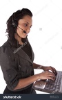 stock-photo-a-business-woman-with-her-headset-on-working-with-a-big-smile-on-her-face-44072284
