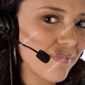 stock-photo-a-close-up-of-a-woman-s-face-with-a-headset-with-a-small-smile-on-her-face-44062462