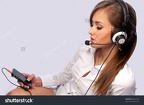 stock-photo-attractive-woman-with-headset-on-a-gray-background-84661342