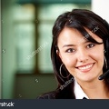 stock-photo-beautiful-business-customer-service-woman-smiling-in-an-office-12944740