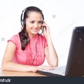 stock-photo-call-center-female-operator-young-happy-smiling-woman-sitting-at-office-desk-with-headset-isolated-85008115