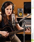 woman-recording-studio-photo-beautiful-brunette-playing-acoustic-guitar-singing-large-diaphragm-microphone-37769749