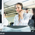 stock-photo-smiling-agent-woman-with-headsets-portrait-of-call-center-worker-at-office-592555262
