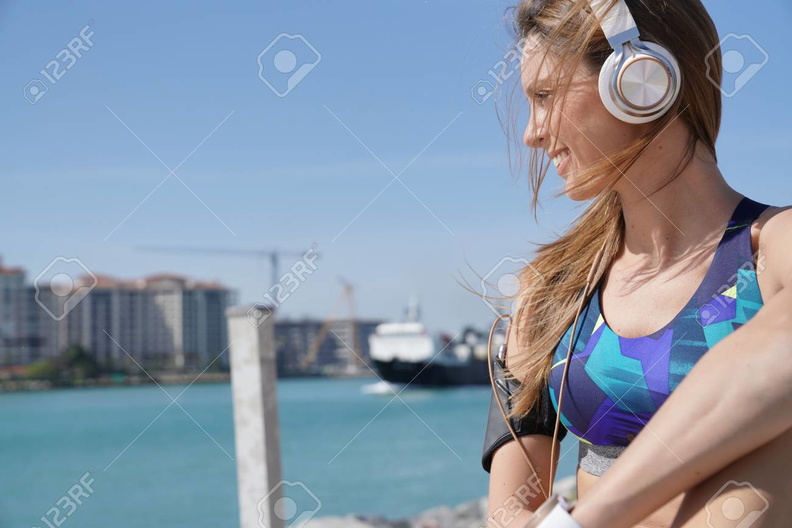 94578837-roller-skater-relaxing-and-listening-to-music-with-headphones.jpg