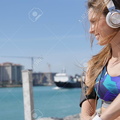 94578837-roller-skater-relaxing-and-listening-to-music-with-headphones