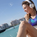 94662984-roller-skater-relaxing-and-listening-to-music-with-headphones