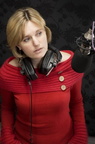 girl wearing her big studio headphones around her neck 44