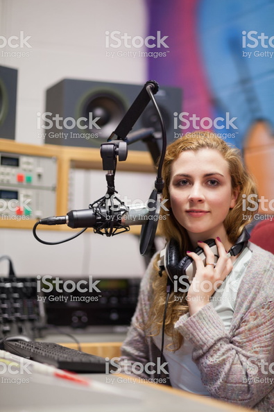 pretty girl wearing her big studio headphones around her neck (2) higher quality.jpg