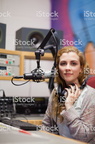 pretty girl wearing her big studio headphones around her neck (2) higher quality