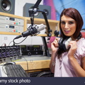 girl wearing her big studio headphones around her neck 40