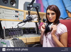 girl wearing her big studio headphones around her neck 40