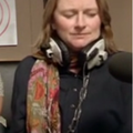 woman wearing big studio headphones around her neck 8.PNG
