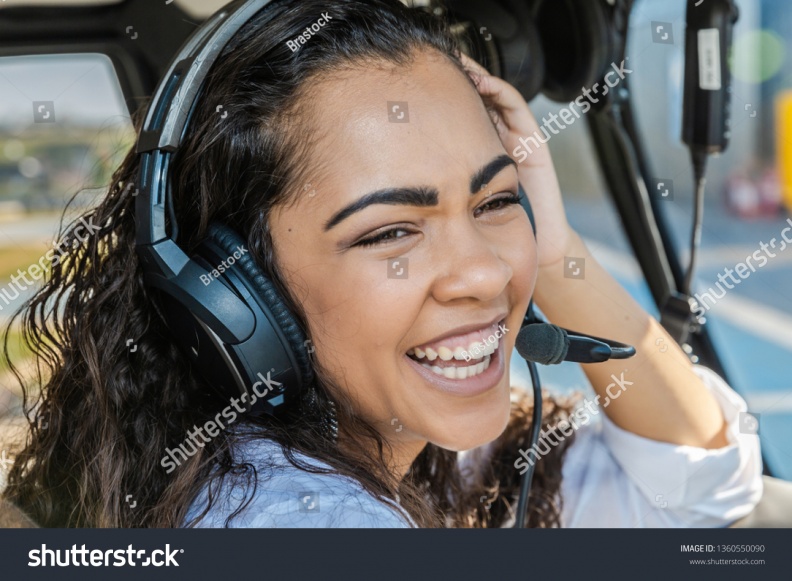 stock-photo-female-pilot-in-cockpit-of-helicopter-before-take-off-young-woman-helicopter-pilot-1360550090.jpg