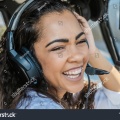 stock-photo-female-pilot-in-cockpit-of-helicopter-before-take-off-young-woman-helicopter-pilot-1360550090.jpg