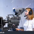 stock-photo-a-female-cameraman-at-a-studio-during-live-broadcasting-57247336