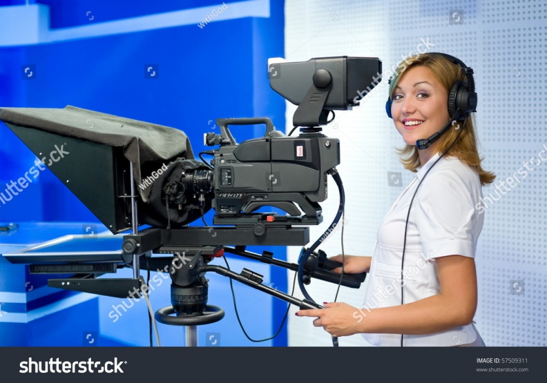 stock-photo-a-female-cameraman-at-a-studio-smiles-into-camera-57509311.jpg